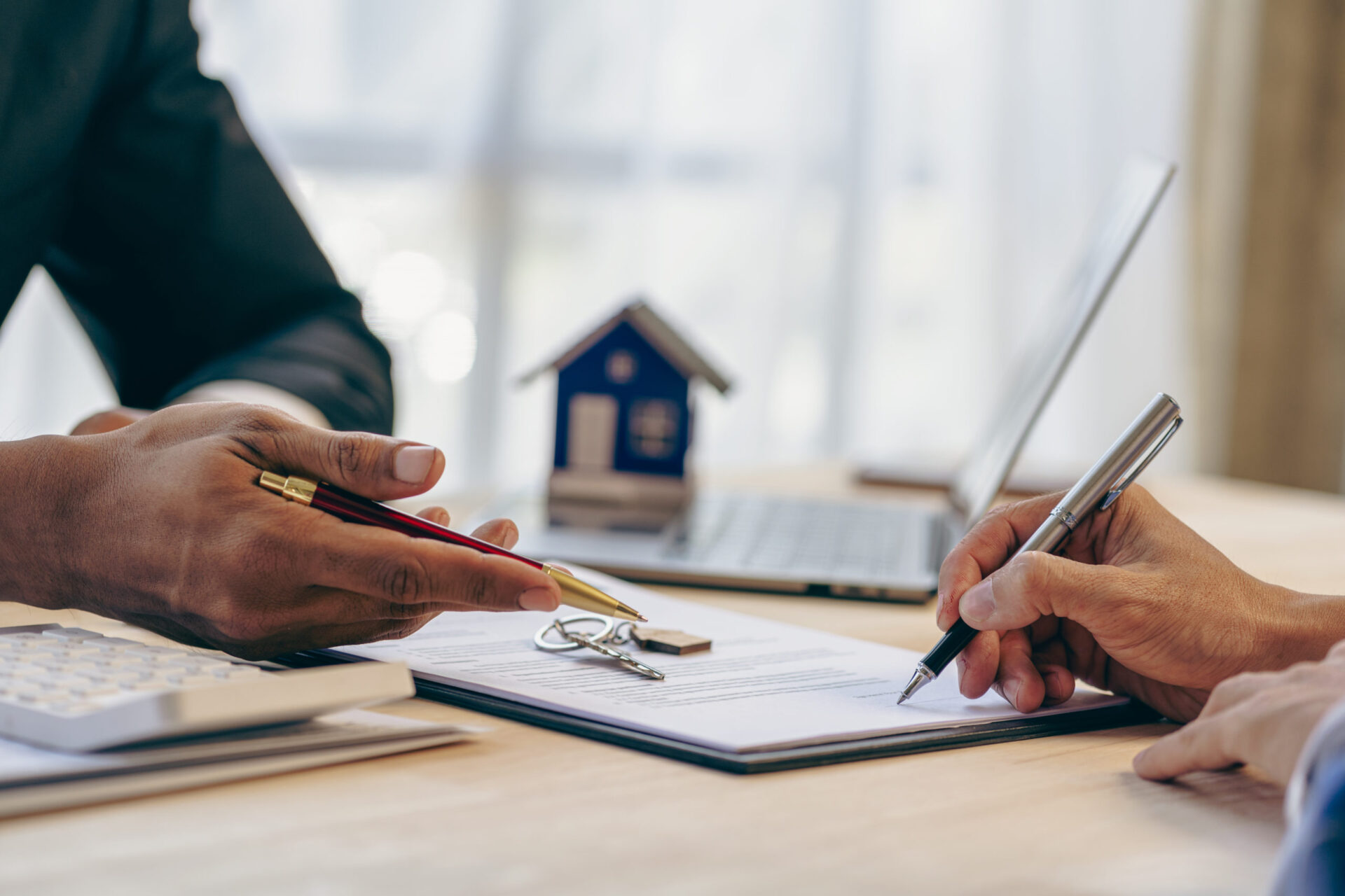 Loan officers recommend homes to clients after signing a real es